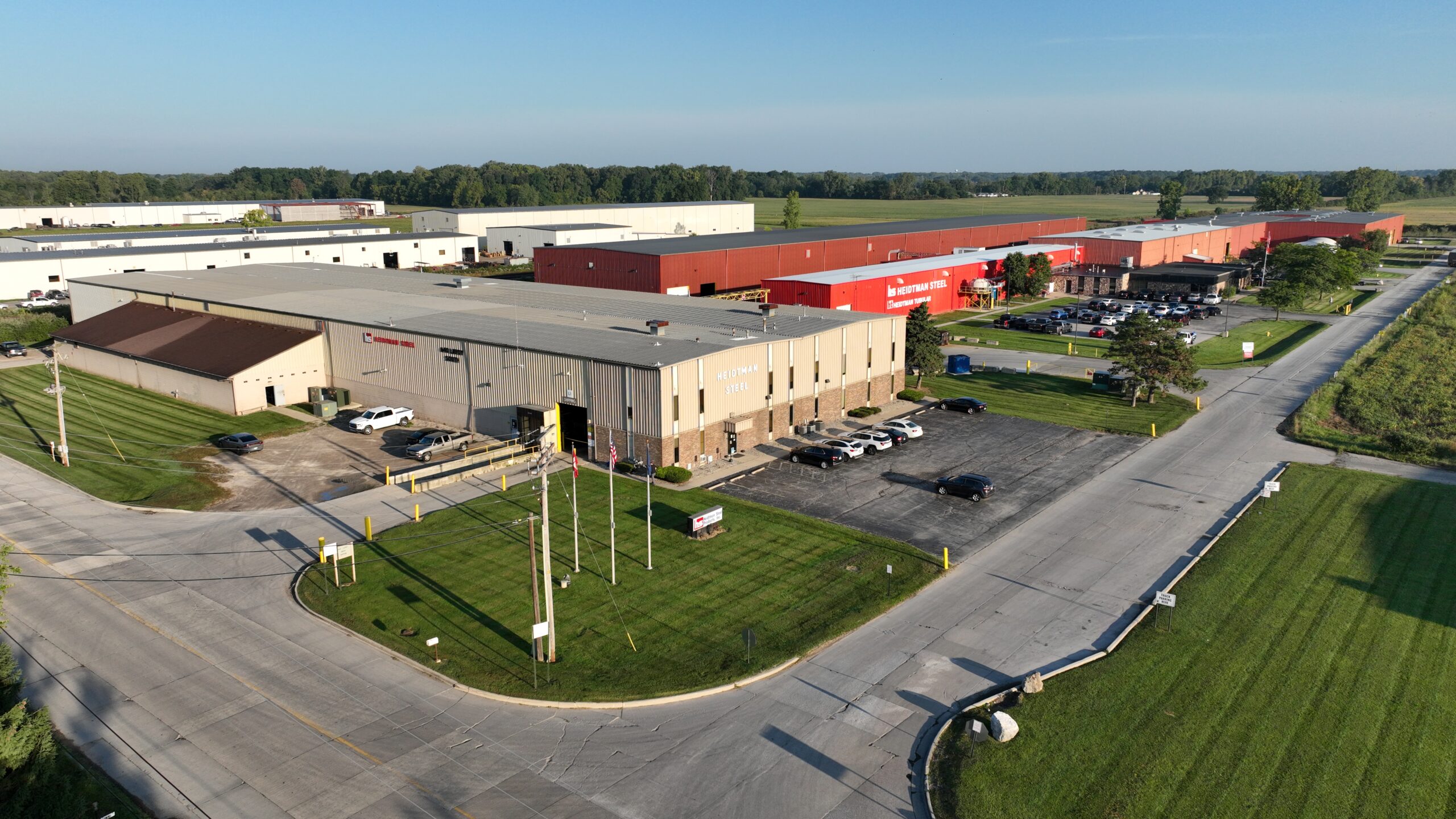 Drone shot of Heidtman Steel Erie MI campus with buildings and parking lot.